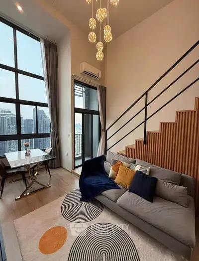 Modern loft living room with high ceilings and city view, featuring stylish decor and large windows.