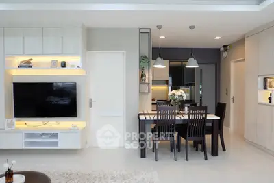 Modern living room with sleek dining area and built-in TV unit
