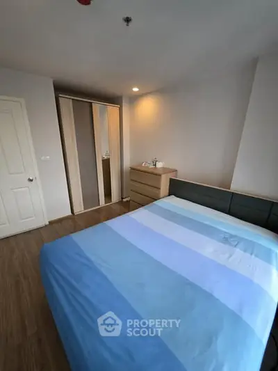 Cozy bedroom with modern furniture and ample storage space