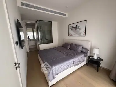 Modern bedroom with ensuite bathroom and stylish decor