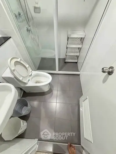 Compact modern bathroom with shower and toilet in sleek design