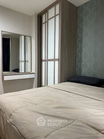 Cozy bedroom with elegant wallpaper and modern wardrobe design