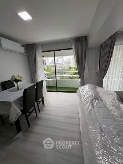 Modern living room with balcony view in urban apartment