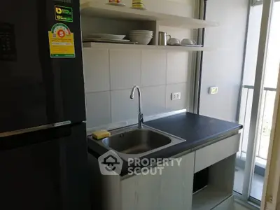 Modern kitchen with sleek design and balcony view