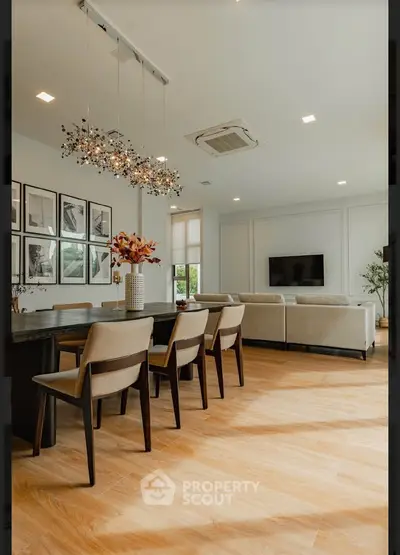 Spacious modern living room with elegant dining area and stylish decor