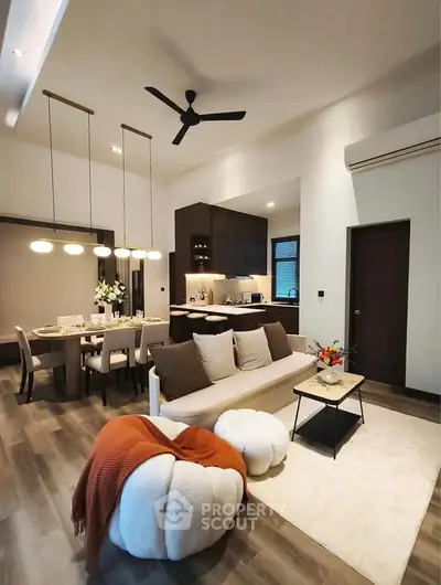 Modern open-plan living room with stylish dining area and cozy decor
