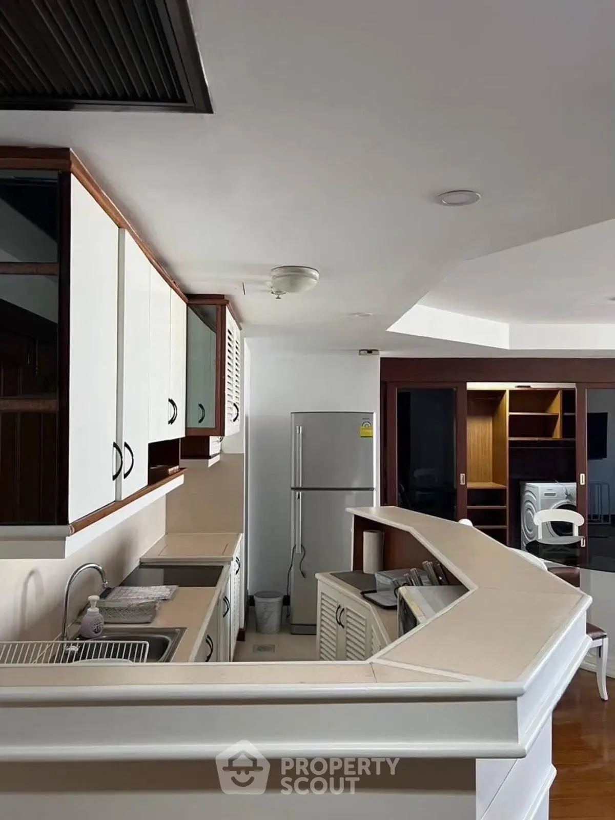 Modern kitchen with sleek countertops and built-in appliances