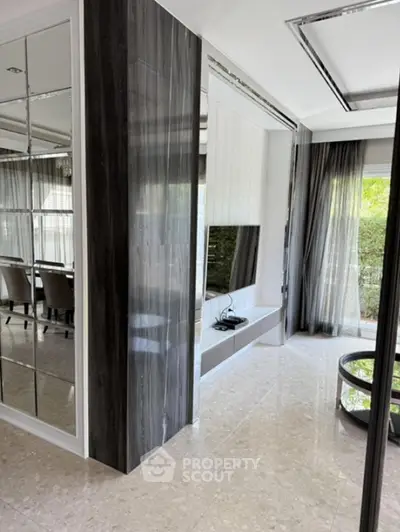 Luxurious modern living room with sleek design and large windows for natural light