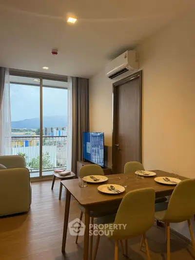 Modern dining area with a view, featuring a sleek table set and air conditioning, perfect for urban living.
