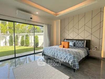 Luxurious bedroom with garden view and modern decor