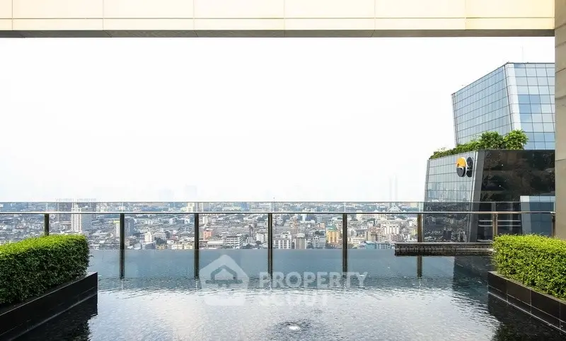 Stunning rooftop infinity pool with panoramic city views in a modern high-rise building.