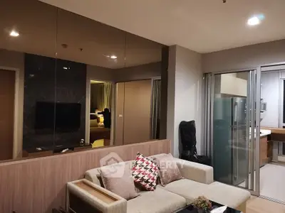 Modern living room with stylish decor and open layout in a contemporary apartment.