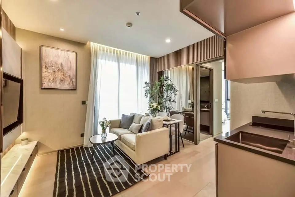 Modern living room with elegant decor and open kitchen layout in luxury apartment.
