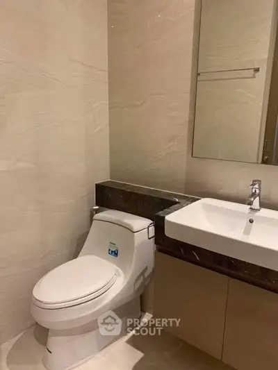 Modern bathroom with sleek fixtures and elegant marble accents