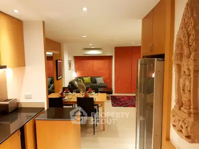 Modern open-plan living room and kitchen with stylish decor and dining area