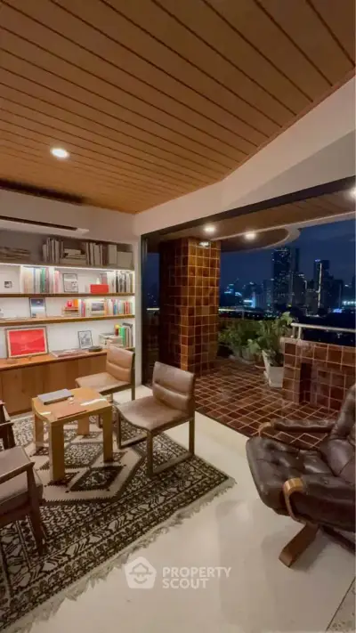 Luxurious living room with city skyline view, featuring elegant furniture and open balcony access.