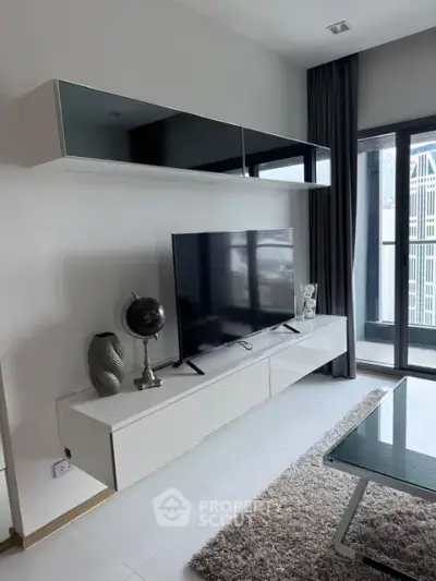 Modern living room with sleek TV setup and large window view