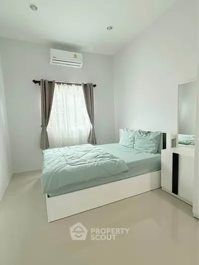 Bright and cozy bedroom with modern furnishings and natural light