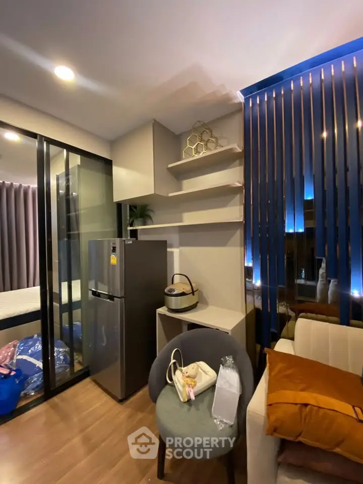 Modern apartment interior with stylish decor and open layout, featuring a cozy living area and sleek kitchen.