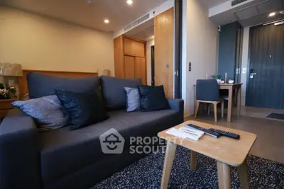 Modern living room with cozy sofa and stylish decor in a contemporary apartment.