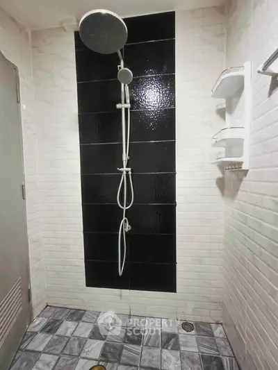 Modern bathroom with sleek black and white shower design