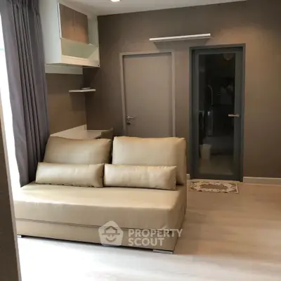 Modern living room with sleek beige sofa and minimalist decor