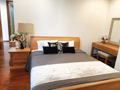 Elegant bedroom with wooden furniture and cozy decor