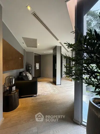 Modern living room with sleek design and large windows for natural light