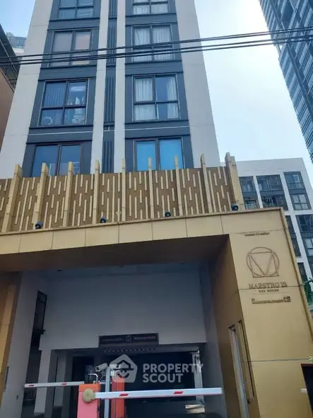 Modern urban building entrance with unique architectural design and secure access.