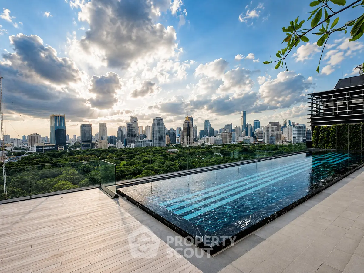 Luxurious rooftop pool with stunning city skyline view, perfect for urban living enthusiasts.