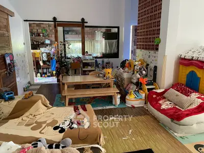 Charming family living room with playful decor and cozy seating area.