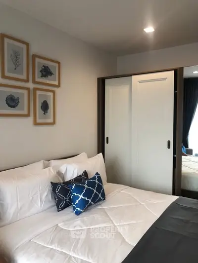 Cozy bedroom with stylish decor and ample storage in modern apartment