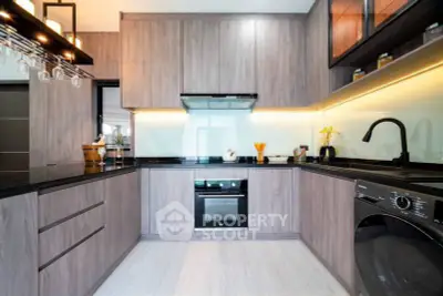 Modern kitchen with sleek cabinetry and built-in appliances
