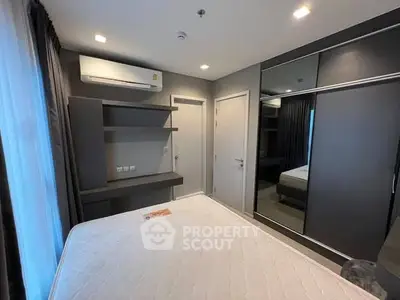 Modern bedroom with sleek design and built-in wardrobe
