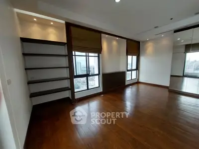 Spacious corner unit with hardwood floors and city views, perfect for modern living.
