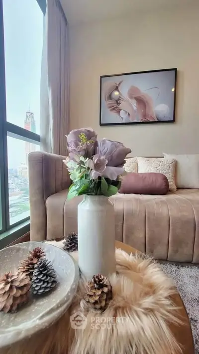 Stylish living room with plush sofa and city view, featuring elegant decor and cozy ambiance.