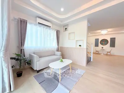 Bright and spacious living room with modern decor and natural light