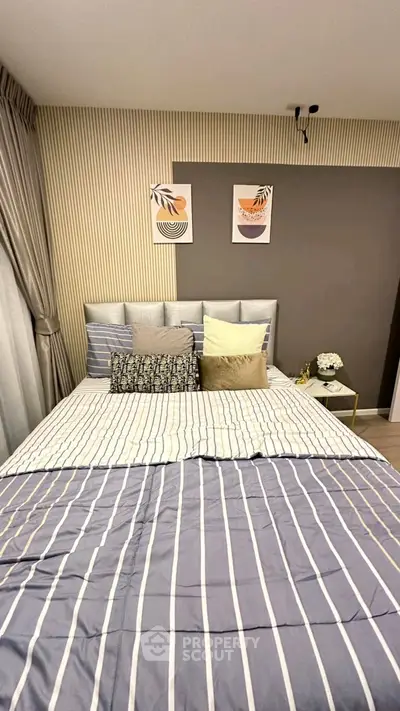 Modern bedroom with stylish decor and cozy bedding