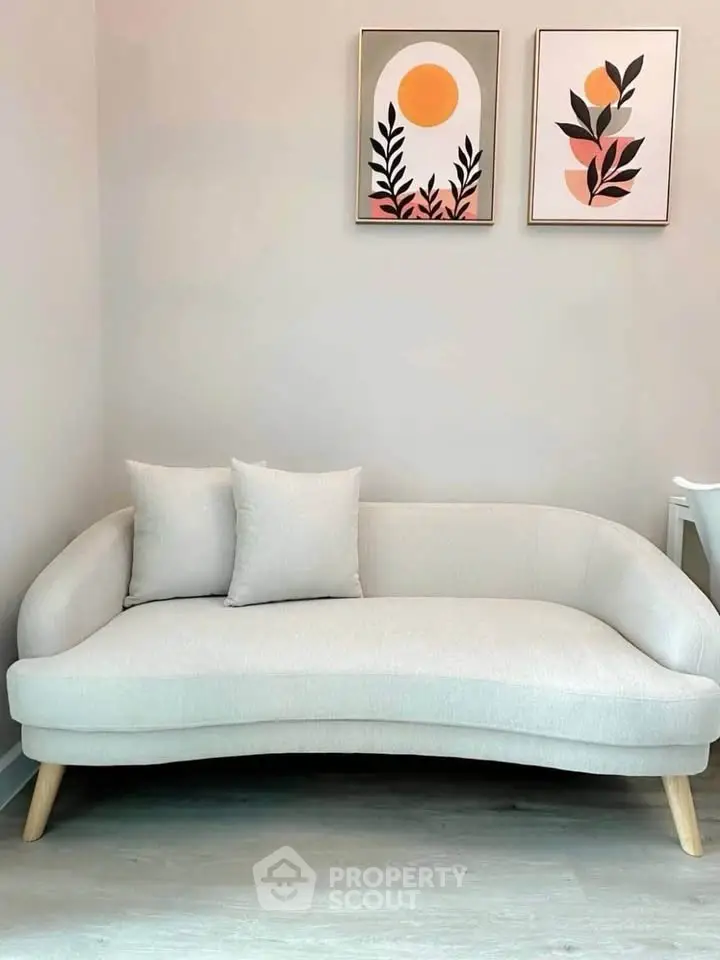 Stylish modern living room with elegant sofa and artistic wall decor