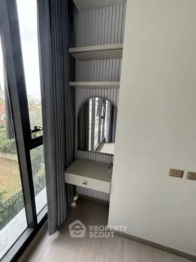 Modern bedroom corner with vanity and large window view