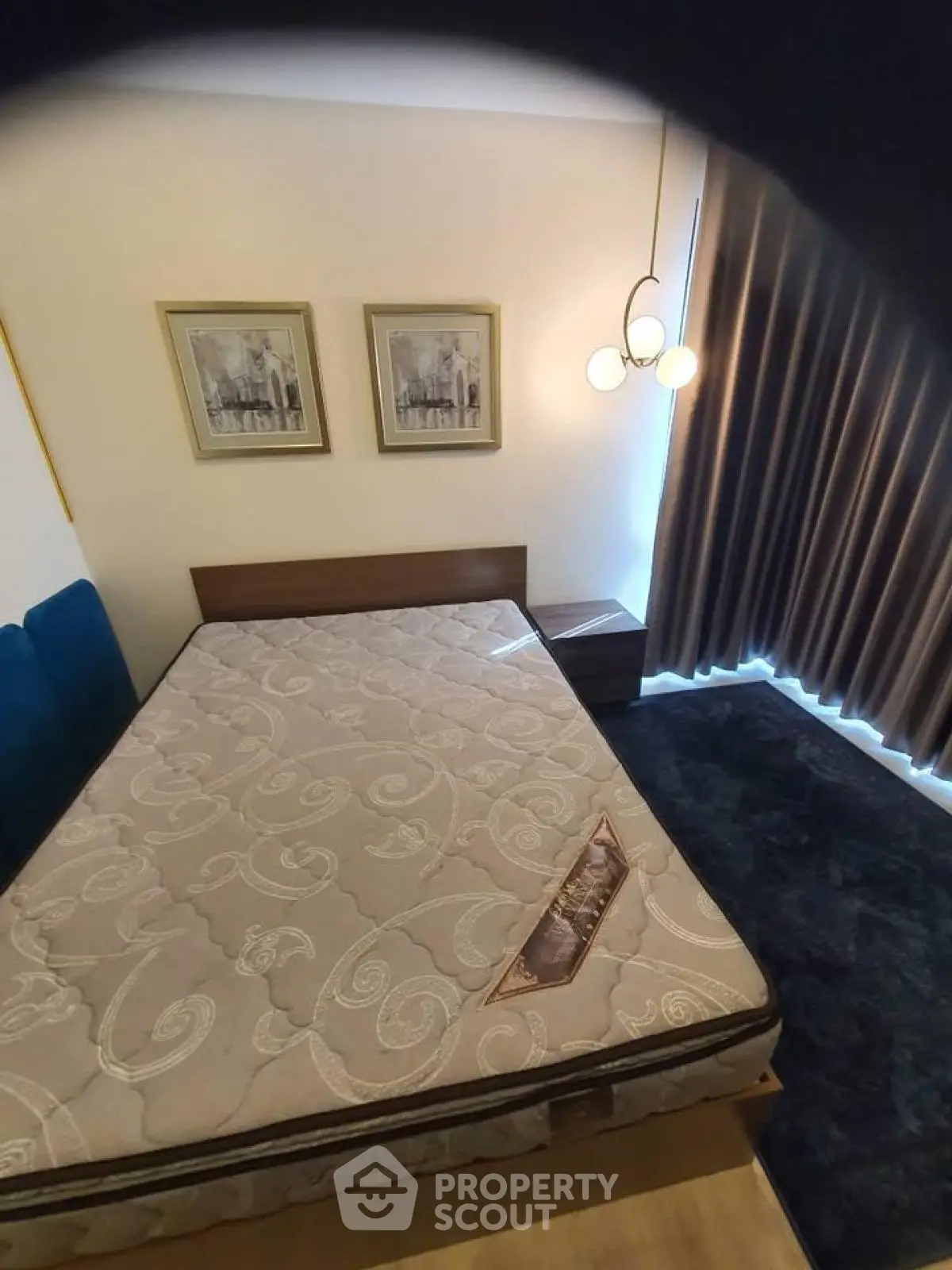 Cozy bedroom with modern decor and large window curtains