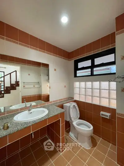 Spacious bathroom with modern fixtures and natural light