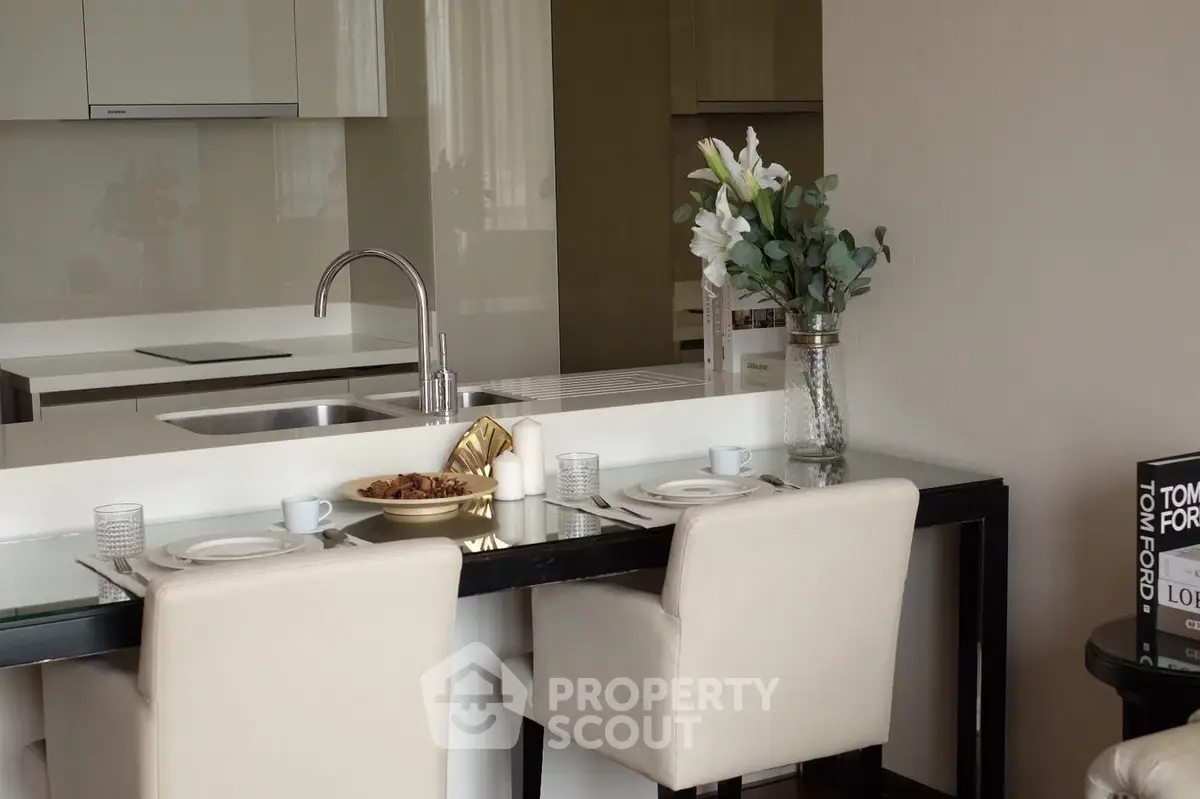 Modern kitchen with elegant dining setup and sleek design
