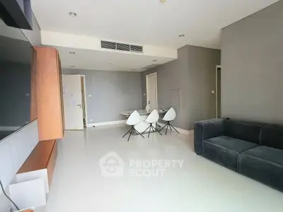 Modern living room with sleek furniture and minimalist design, perfect for urban living.
