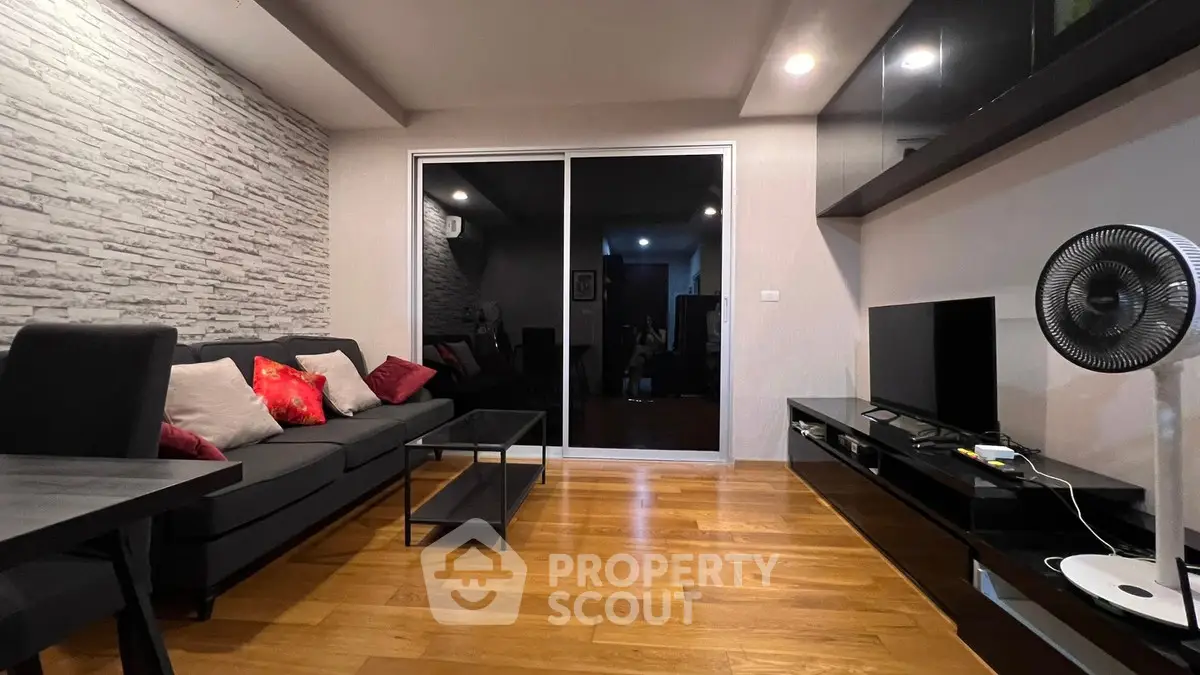 Modern living room with sleek furniture and wooden flooring