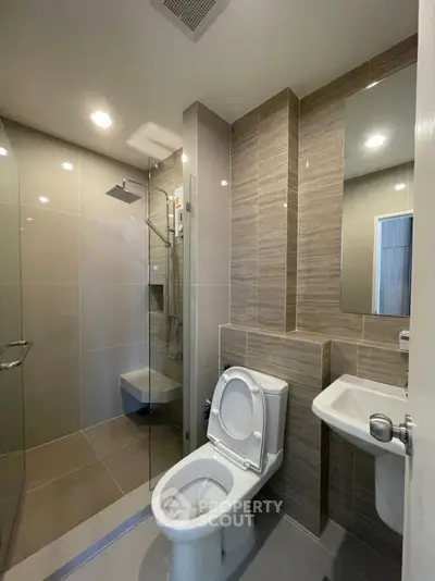 Modern bathroom with sleek design and glass shower enclosure