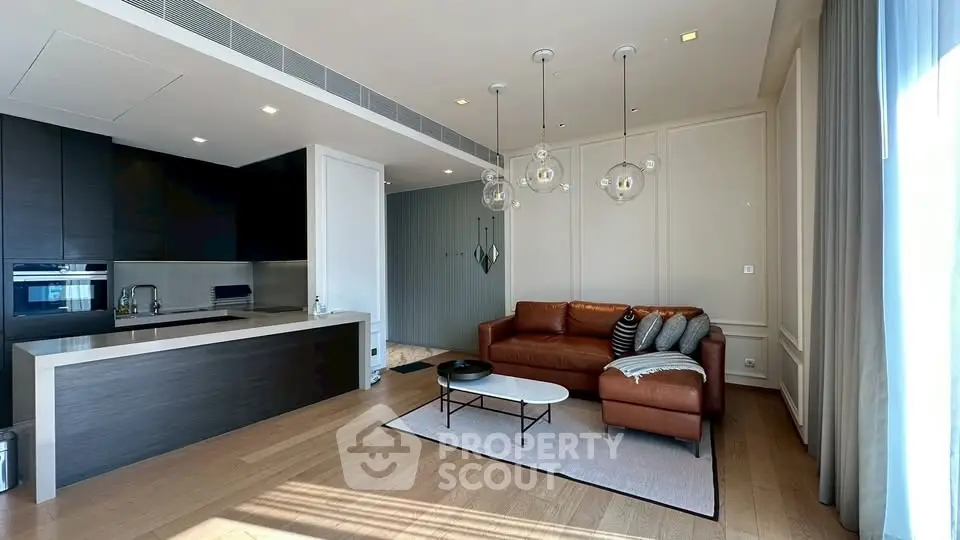 Modern living room with open kitchen and stylish decor