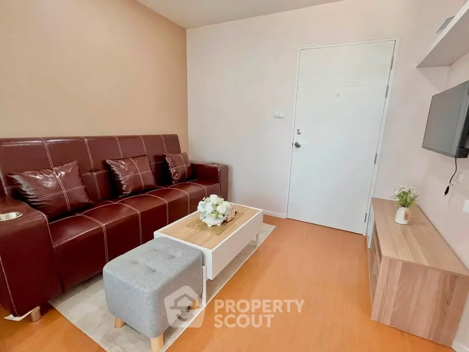 Cozy living room with modern furniture and stylish decor, perfect for relaxation and entertainment.