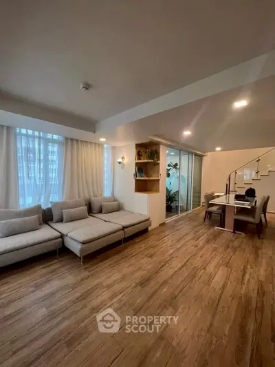 Spacious modern living room with elegant decor and ample natural light