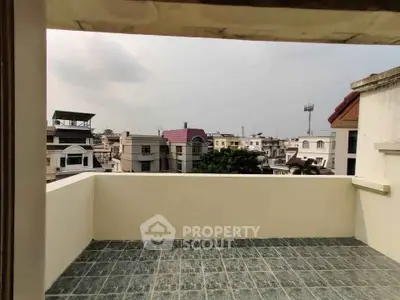 Spacious balcony with city view, perfect for relaxation and enjoying the skyline.